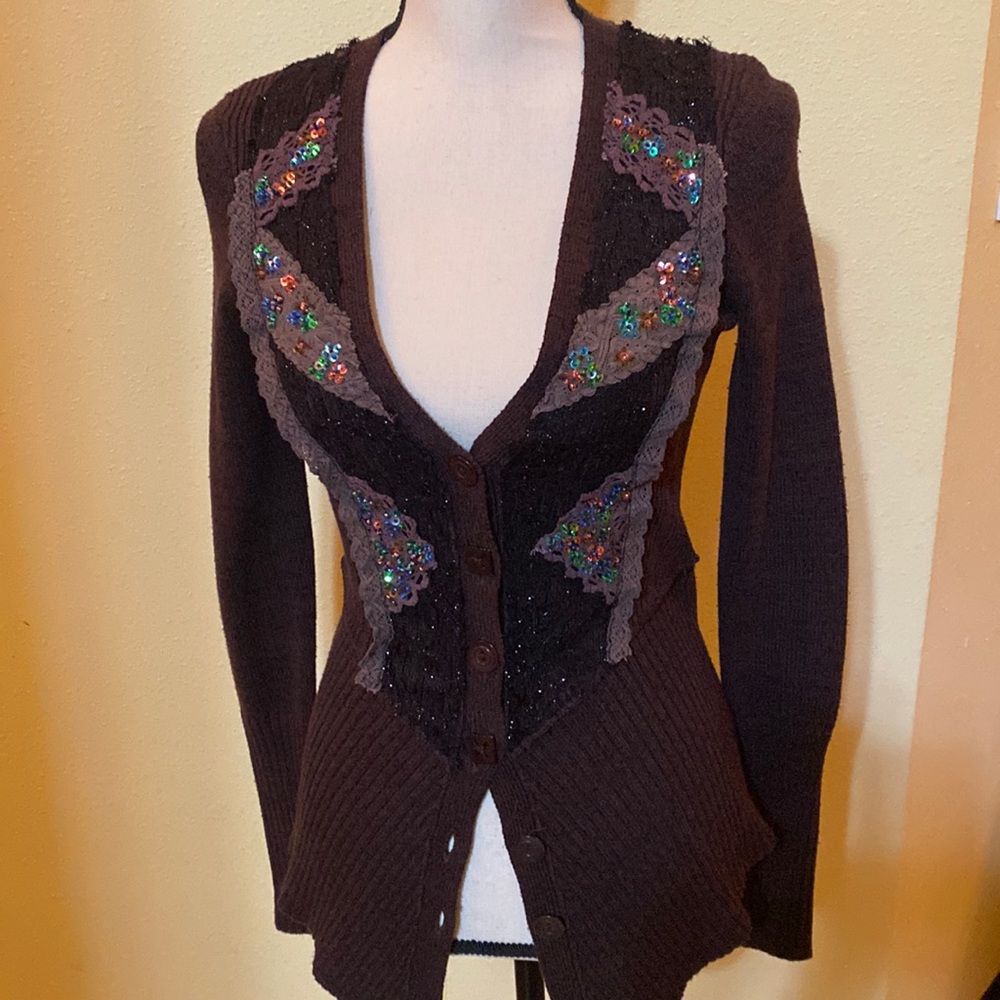 Free people chocolate cardigan with sequence and lace decor.